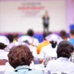 Nurses in a conference room at a lecture