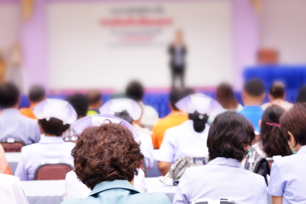 Nurses in a conference room at a lecture